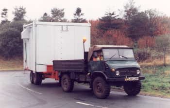 Unimog S404 towing cell phone equipment trailer